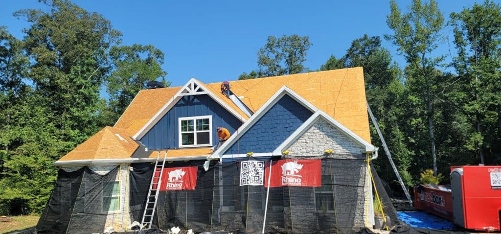 Rhino Restoration installing durable architectural shingles after an approved insurance claim